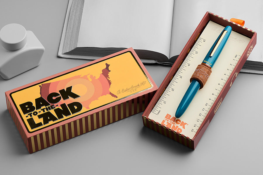 Esterbrook Estie - Funky Lake / Gold - Broad fountain pen set, featuring a teal pen with leather band and Back to the Land themed box.