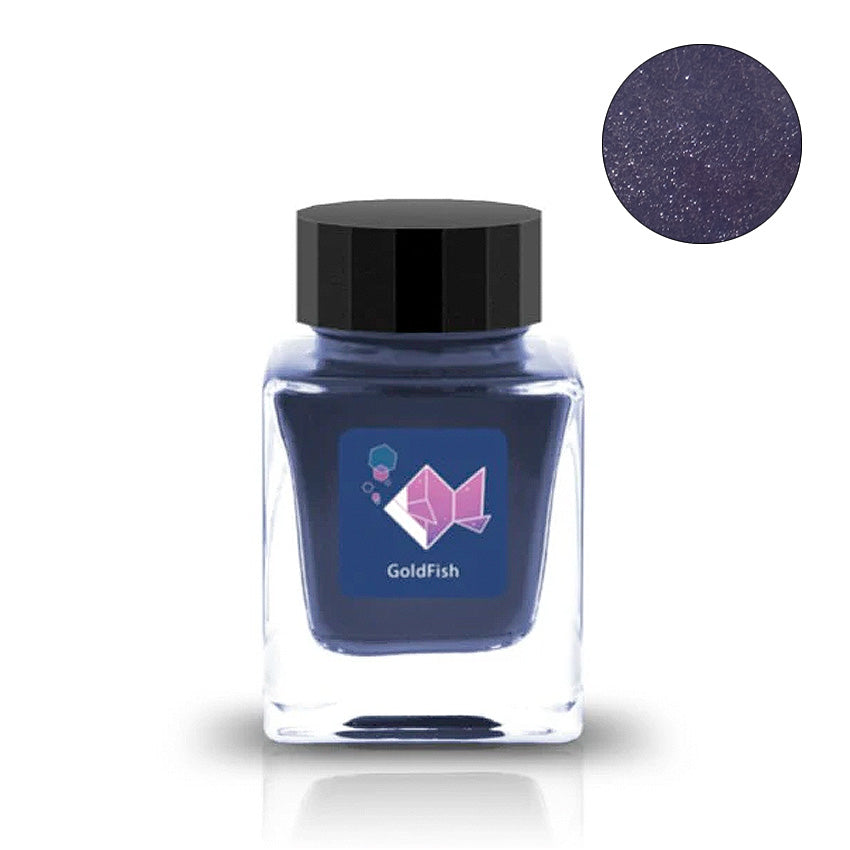 Goldfish (Shimmer) fountain pen ink by Tono & Lims in a 30ml square glass bottle, featuring a shimmering dark blue-purple hue. Close-up shows sparkly finish.