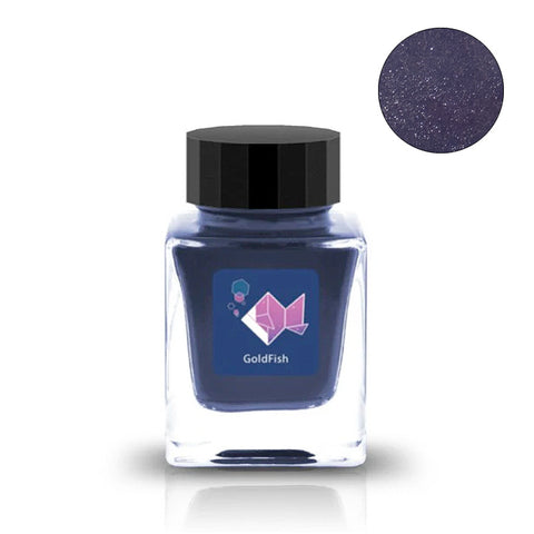 Goldfish (Shimmer) fountain pen ink by Tono & Lims in a 30ml square glass bottle, featuring a shimmering dark blue-purple hue. Close-up shows sparkly finish.