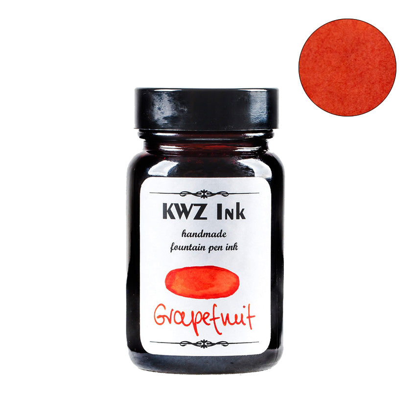 KWZ Ink's Grapefruit fountain pen ink in a 60ml glass bottle with a black cap, featuring orangey-red color swatch and handmade label.