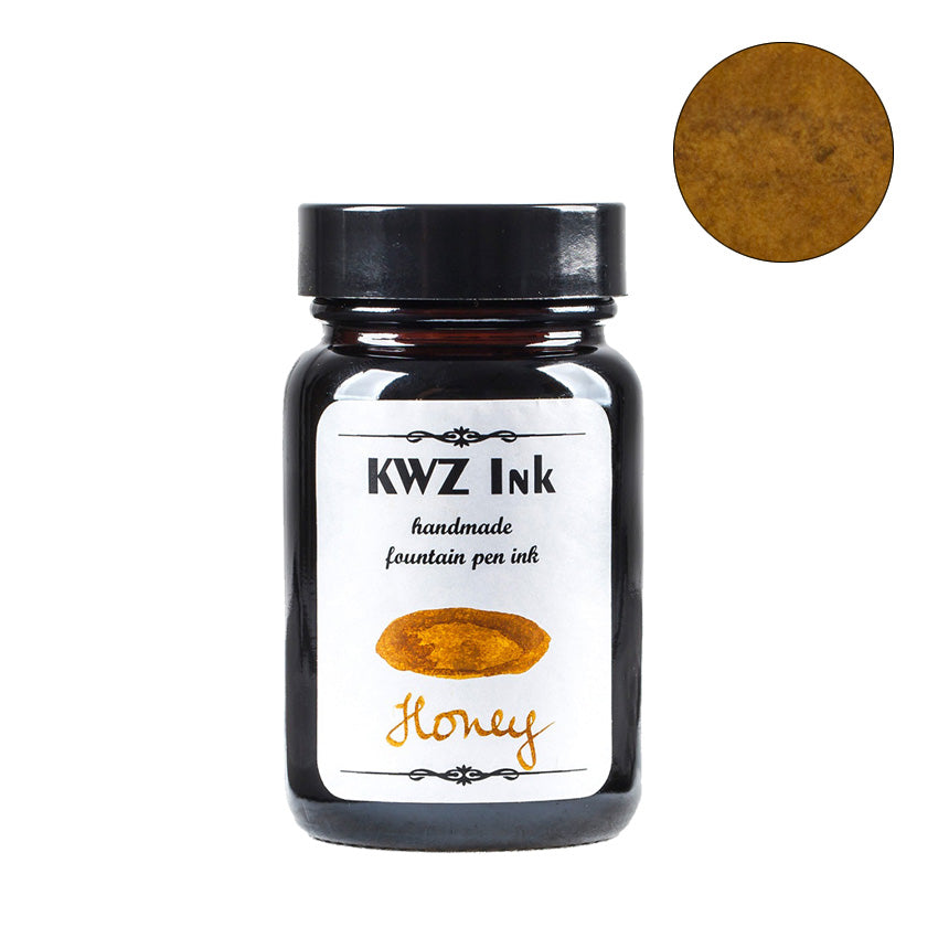 KWZ Ink Honey - 60ml fountain pen ink in a dark glass bottle, showcasing a honey-tone color swatch on the label and corner.