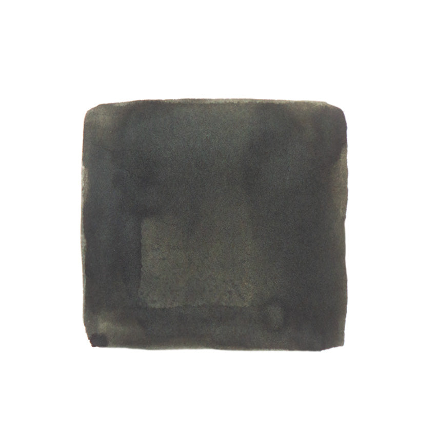 KWZ Ink Hunter Green - 60ml fountain pen ink, dark gray-black swatch with uneven edges, subtle tone variations, emphasizing unique color and craftsmanship in Desk Bandit's collection.