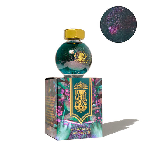 Ferris Wheel Press The Wild Swans - Knitted Nettle fountain pen ink, 20ml, in a round glass bottle with gold cap, featuring shimmering teal ink with pink particles.