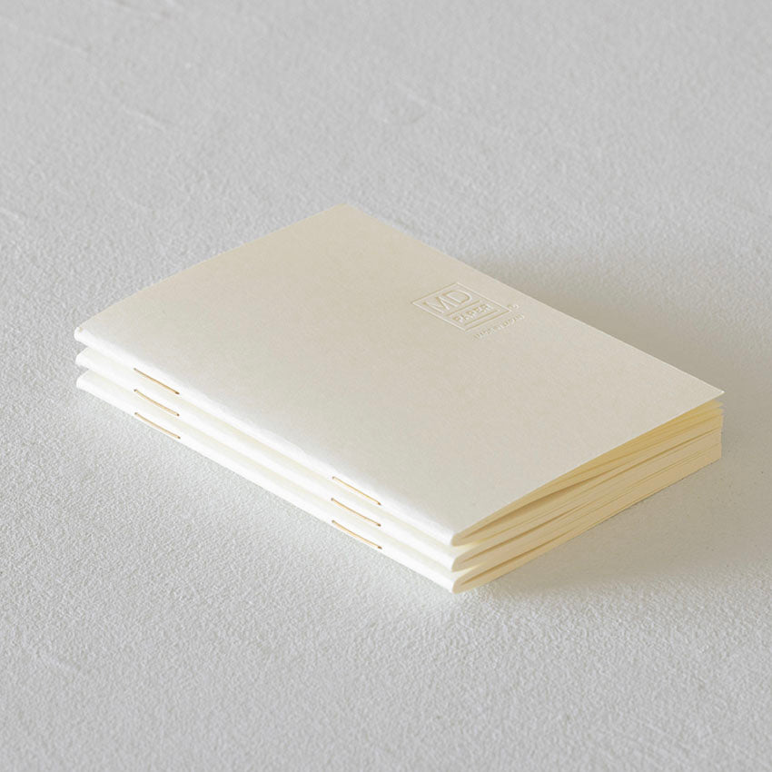 MD Notebook Light – B6 Slim Grid (3 Pack), features three cream, staple-bound notebooks with MD PAPER logo, ideal for portability and fountain pen use.