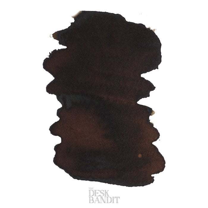 Ink swatch of Robert Oster's Motor Oil - 2ml, showing a dark brown, almost black, fountain pen ink with THE DESK BANDIT printed below.