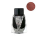 PENBBS No.541 George Gordon Byron fountain pen ink in a 30ml faceted glass bottle with black cap, showcasing a deep, rusty red metallic sheen.