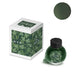 Project Ink No.064 Boxwood - 15ml: Boxed dark-green ink bottle with leafy motif packaging, showcasing a circular swatch of its vibrant color.