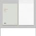 Nobile Notepad - A5 (Blank) by Wearingeul. Muted gray-beige cover with gold text, showcasing 100 fountain pen friendly pages. Ideal for ink expression.