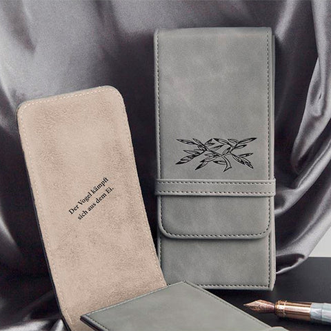 Wearingeul World Classic Literature Pen Pouch (Demian) featuring a gray eco-leather exterior with bamboo art, open to reveal beige suede interior embossed with German text.