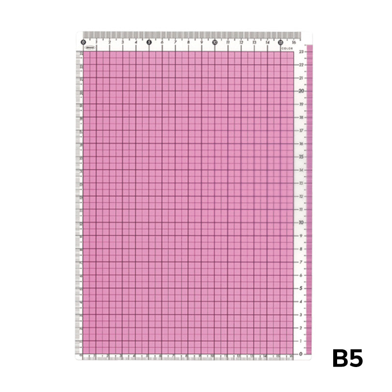 B5 Pencil Board (Pink) by Kyoei Orions, featuring a self-healing surface with a 1 cm grid and cm/mm ruler markings, ideal for precise cutting tasks.