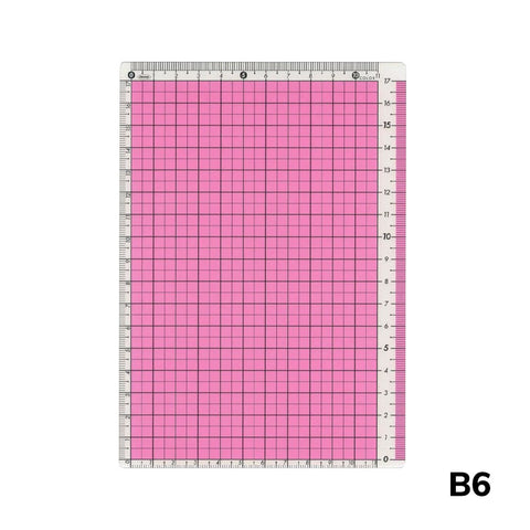 B6 Pencil Board (Pink) by Kokuyo, a self-healing cutting mat with 1 cm grid and edge rulers, ideal for precision crafting and measuring.