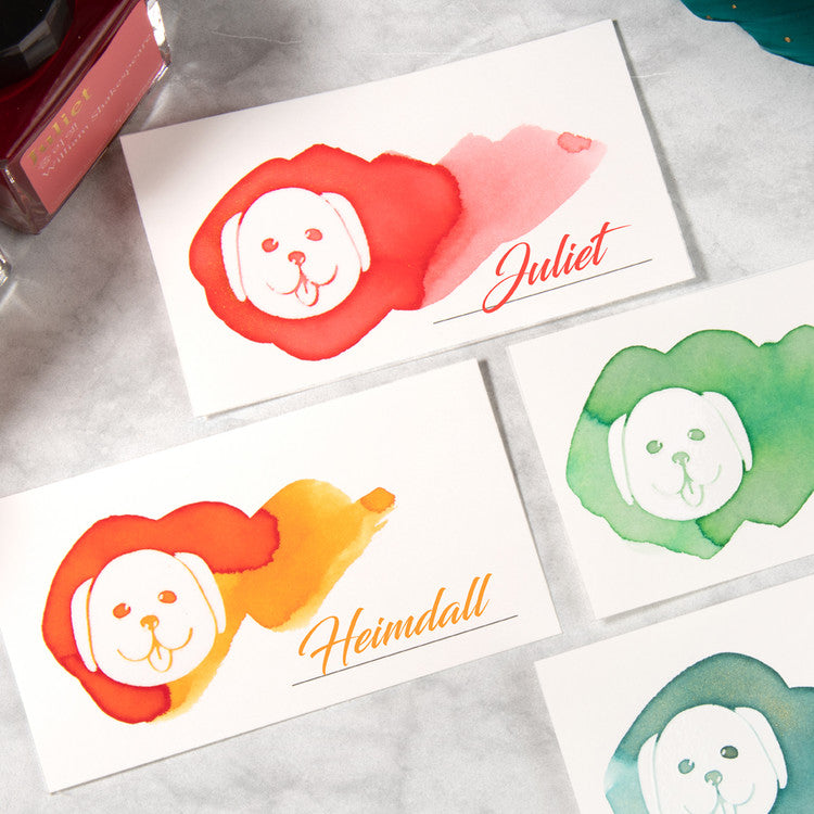Wearingeul 'White Puppy' Ink Swatch Cards, featuring watercolor puppy designs with personalized names, on 200gsm fountain pen friendly paper, displayed with matching ink bottle.