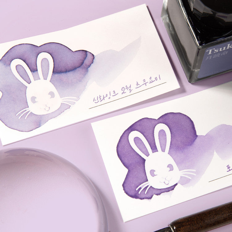 Wearingeul White Rabbit Ink Swatch Cards feature rabbit silhouettes on 5x9cm paper, shown with Tsukineko fountain pen ink, dip pen, and lavender ink dish.