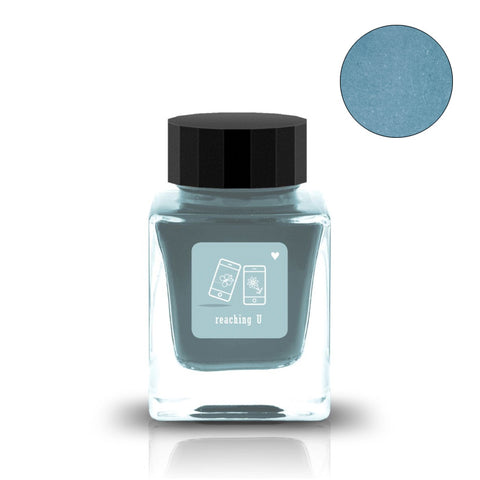 Tono & Lims Reaching U fountain pen ink, 30ml bottle with muted teal-blue dye-based ink, features a unique smartphone and flower label design.