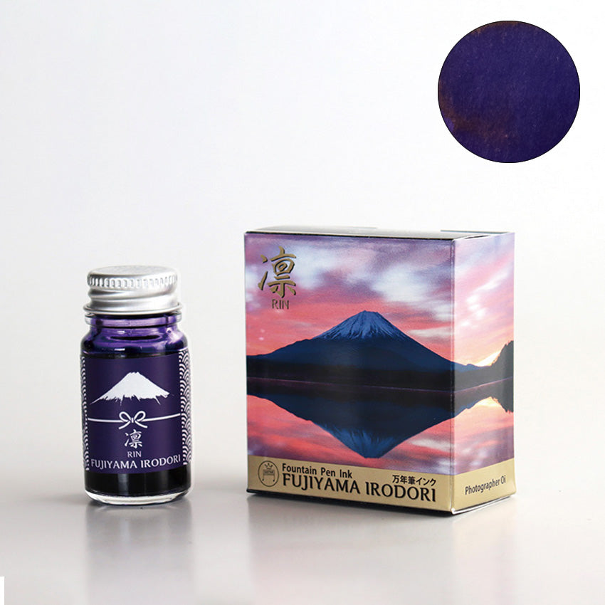 Rin / Fujiyama Irodori fountain pen ink by Teranishi, 12ml, featuring a Mount Fuji-themed design, showcasing a deep purple/navy hue, with a silver screw cap.