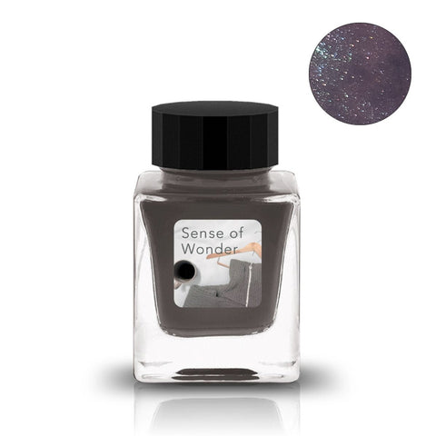 Tono & Lims Sense of Wonder shimmer fountain pen ink, 30ml, in a square glass bottle with a black cap, showcasing a pearly, sparkly finish.