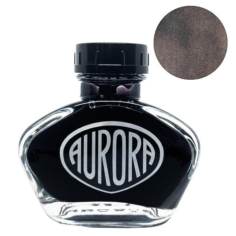 Aurora 100th Anniversary - Sepia (55ml) ink bottle with teardrop-shaped design and AURORA logo, displayed next to a circular swatch of its dark brown color.