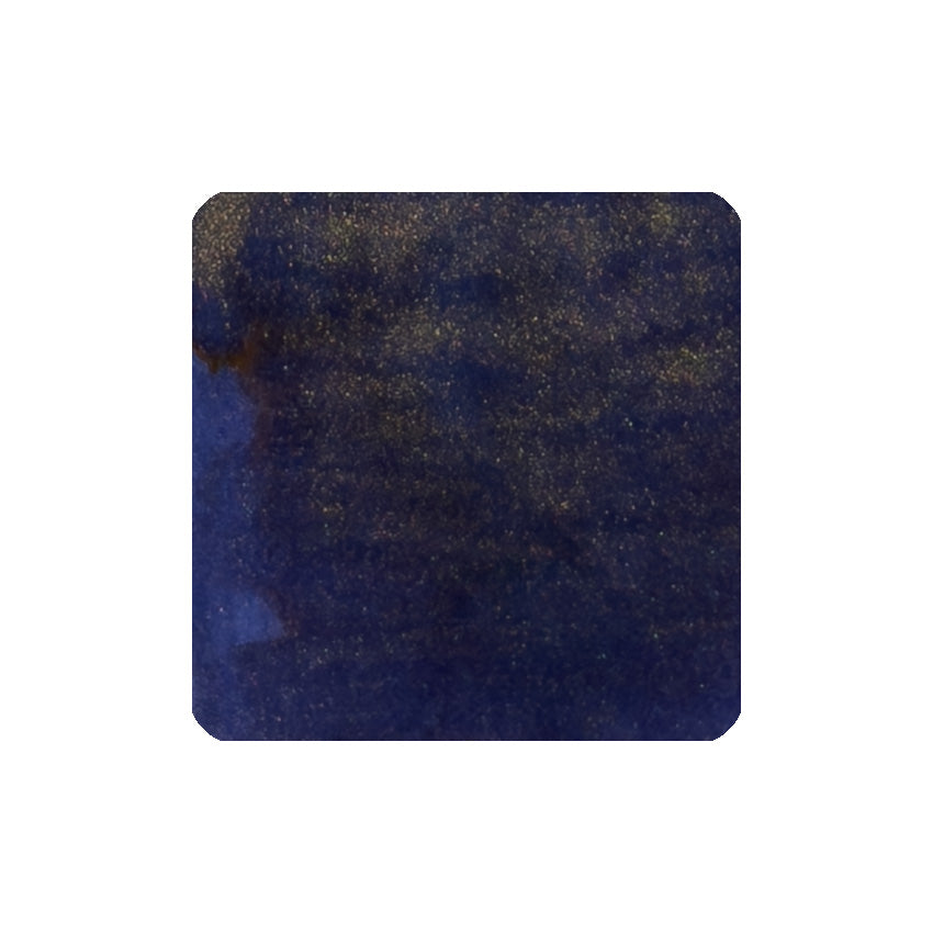 Shimmering Seas (Shimmer) - 50ml fountain pen ink by Diamine, showcasing a dark blue hue with reflective gold shimmer particles, perfect for vintage pens.