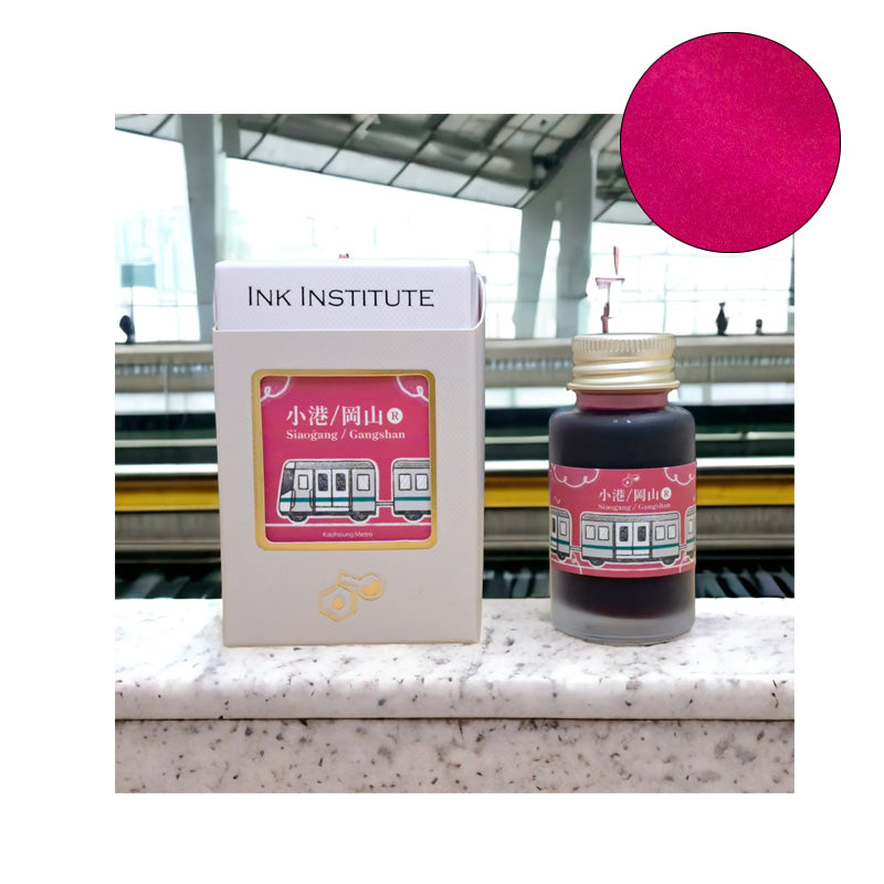 Ink Institute Siaogang/Gangshan (Kaohsiung Metro) fountain pen ink set, featuring a 30ml bottle with pink/magenta label, displayed on a metro platform.