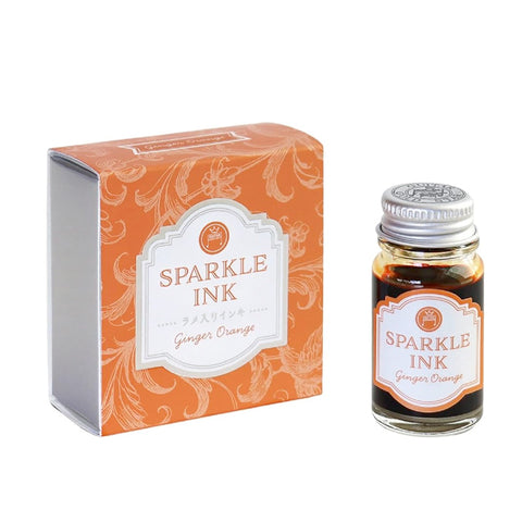 Teranishi Sparkle Ink Dip Pen Ink - Ginger Orange (12ml), featuring a shimmer effect, displayed in a glass bottle with matching box, ideal for fountain pen enthusiasts.