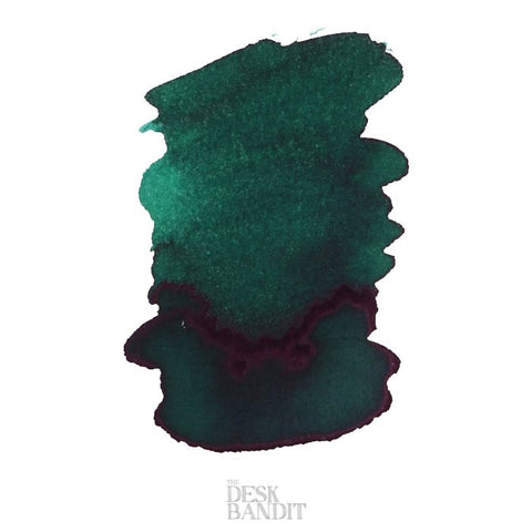 Spearmint - 2ml ink sample by Robert Oster, showing dark teal-green hue with pooling edges and subtle center shading, from The Desk Bandit's review.