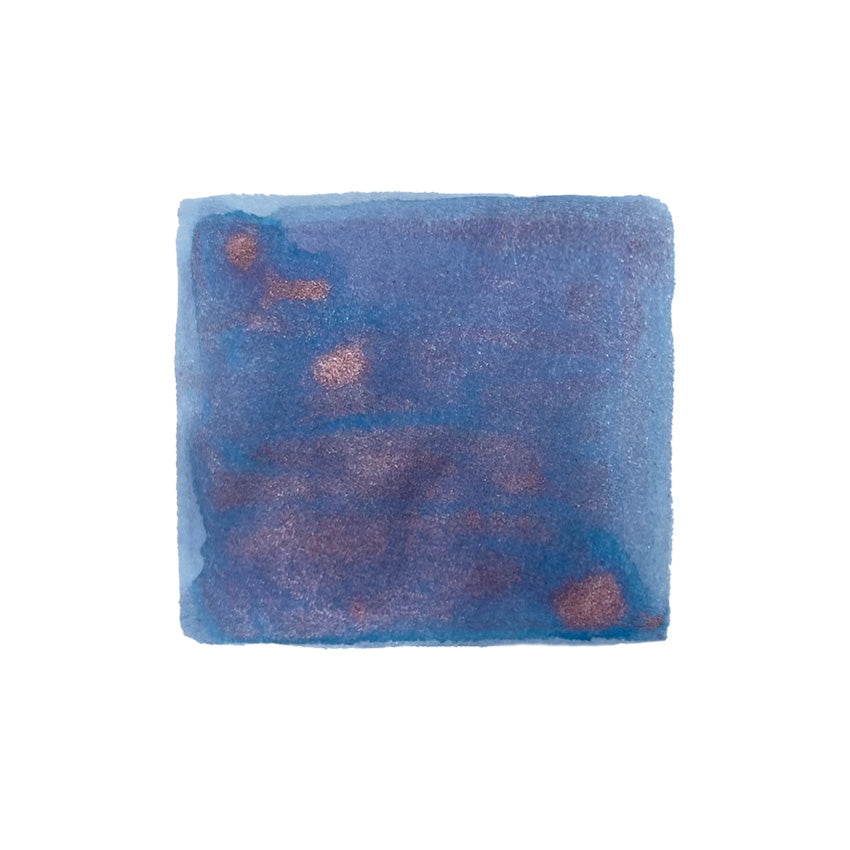 Journalize Starburst Glaze (Shimmer) - 30ml fountain pen ink swatch, showcasing deep blue-violet with metallic copper shimmer, highlighting texture and granulation.