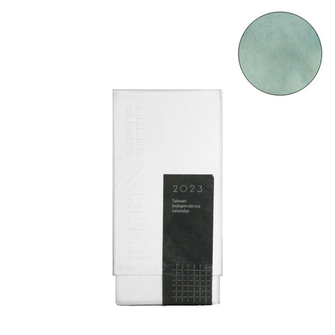Packaged Terra Green - 30ml fountain pen ink by Ink Institute, featuring a 2023 Taiwan independence calendar with textured pastel green paper detail, ideal for fountain pen use.