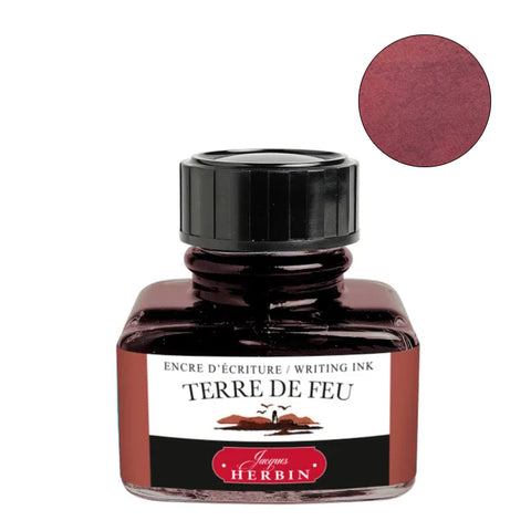 Jacques Herbin Terre de Feu fountain pen ink, 30ml bottle, showcasing its warm reddish-brown hue through a glass bottle and color swatch.