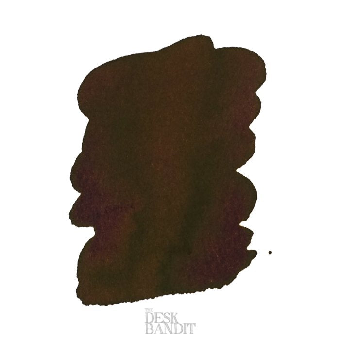 Iroshizuku Ink - Tsukushi (2ml) sample, showing a dark olive-brown ink swatch with The Desk Bandit watermark on a white background.