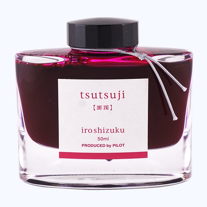 Iroshizuku Ink - Tsutsuji (50ml) in a glass bottle with a black cap, silver cord, and label detailing, showcasing Pilot's azalea-inspired deep pink ink.