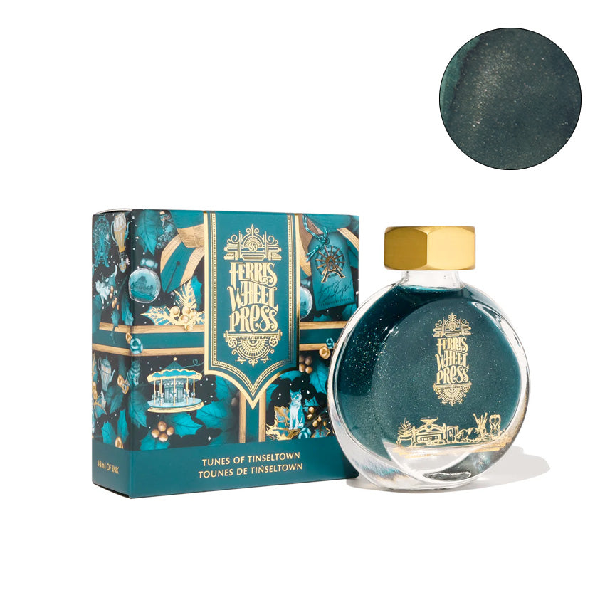 Ferris Wheel Press Tunes of Tinseltown Shimmer - 38ml fountain pen ink in a round glass bottle with gold accents, presented in a decorative box.