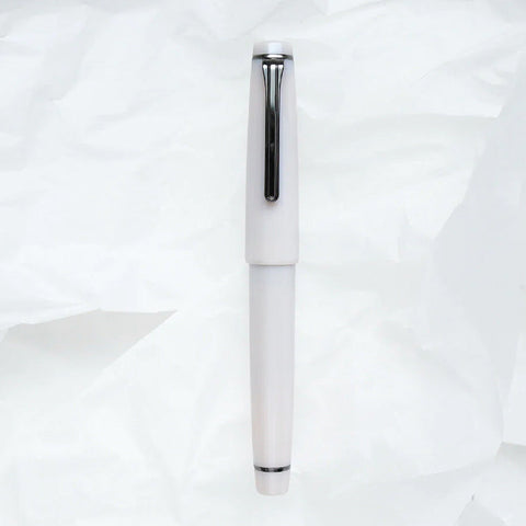 Usugumo Professional Gear Fountain Pen - Medium Fine by Kyo No Oto, featuring a polished silver clip and 21K gold nib, showcased against a crumpled white paper background.