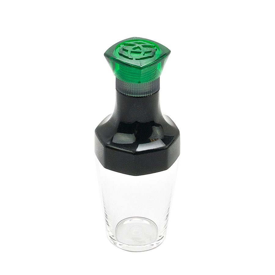 VAC20A Ink Bottle - Green: Clear storage jar with a two-piece grinder lid, designed for TWSBI pen refills, featuring green top and black middle section.