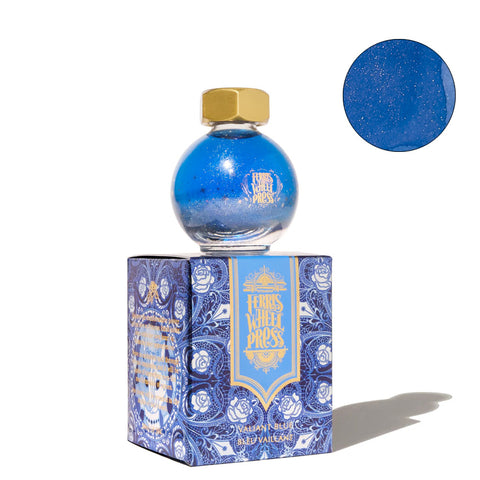 Ferris Wheel Press The Beauty and the Beast - Valiant Blue fountain pen ink, 20ml, in orb-shaped bottle with shimmering deep blue hue, atop decorative box.