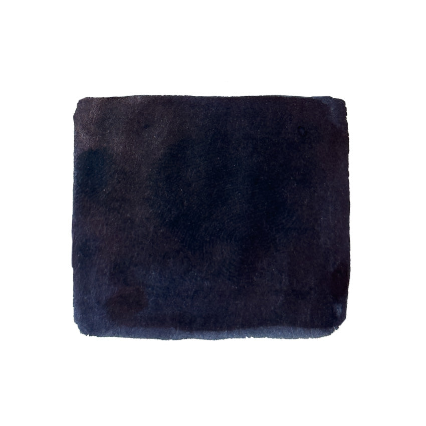 Warsaw Dreaming - 60ml KWZ Ink, iron gall-based fountain pen ink, presented in a soft, plush, dark cleaning pad against a white background.