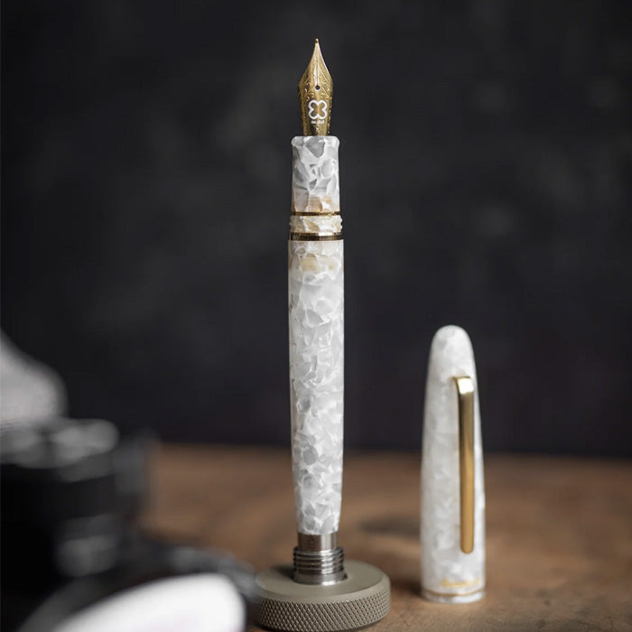 Esterbrook Estie - Winter White / Gold - Mini Stub fountain pen with gold trim and detailed nib, showcasing luxury marbled resin design.