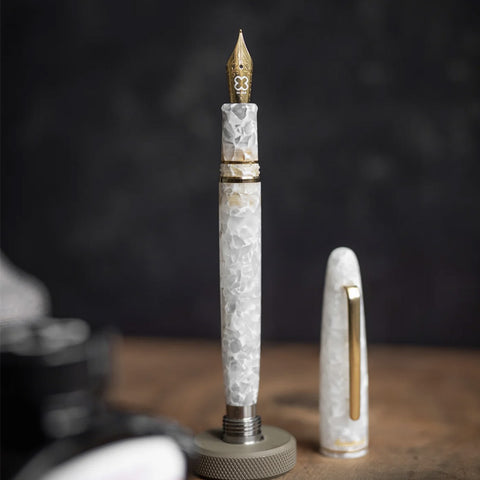 Esterbrook Estie - Winter White / Gold - Mini Stub fountain pen with gold trim and detailed nib, showcasing luxury marbled resin design.
