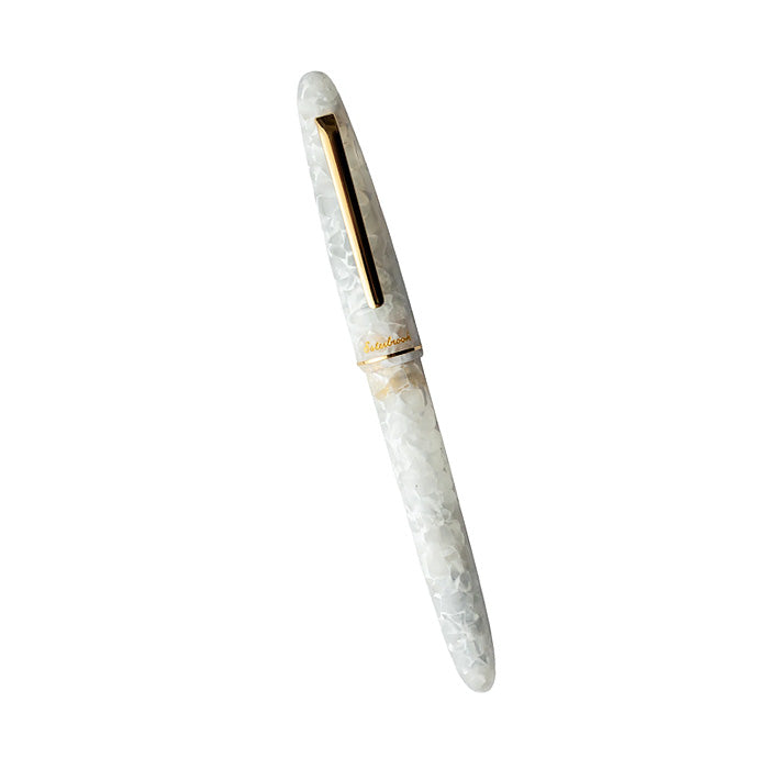 Esterbrook Estie fountain pen in Winter White with gold trim, featuring a fine stainless steel nib and marbled resin body.