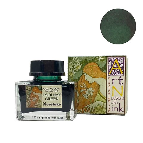 Kuretake Art Nouveau fountain pen ink, Zsolnay Green, 20ml. Square glass bottle with black cap, alongside decorative Art Nouveau box featuring a red-haired lady amidst lilies.