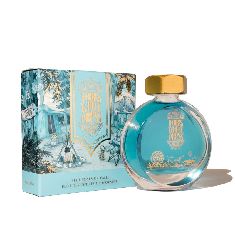 Ferris Wheel Press Blue Yosemite Falls fountain pen ink, 30ml bottle with gold cap, alongside matching illustrated box showcasing outdoor and amusement park themes.