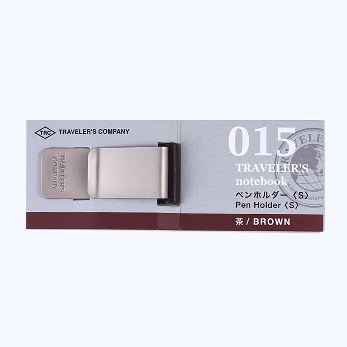 #015 Pen Clip - Small (Brown) by Traveler's Company: A compact metal clip with a leather loop, designed to attach pens to a Traveler’s Notebook cover.
