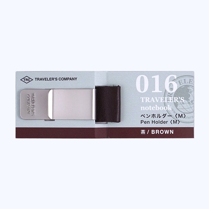#016 Pen Clip - Medium, a Traveler's Company accessory, featuring a metal clip with a medium leather loop to hold pens up to 12mm.