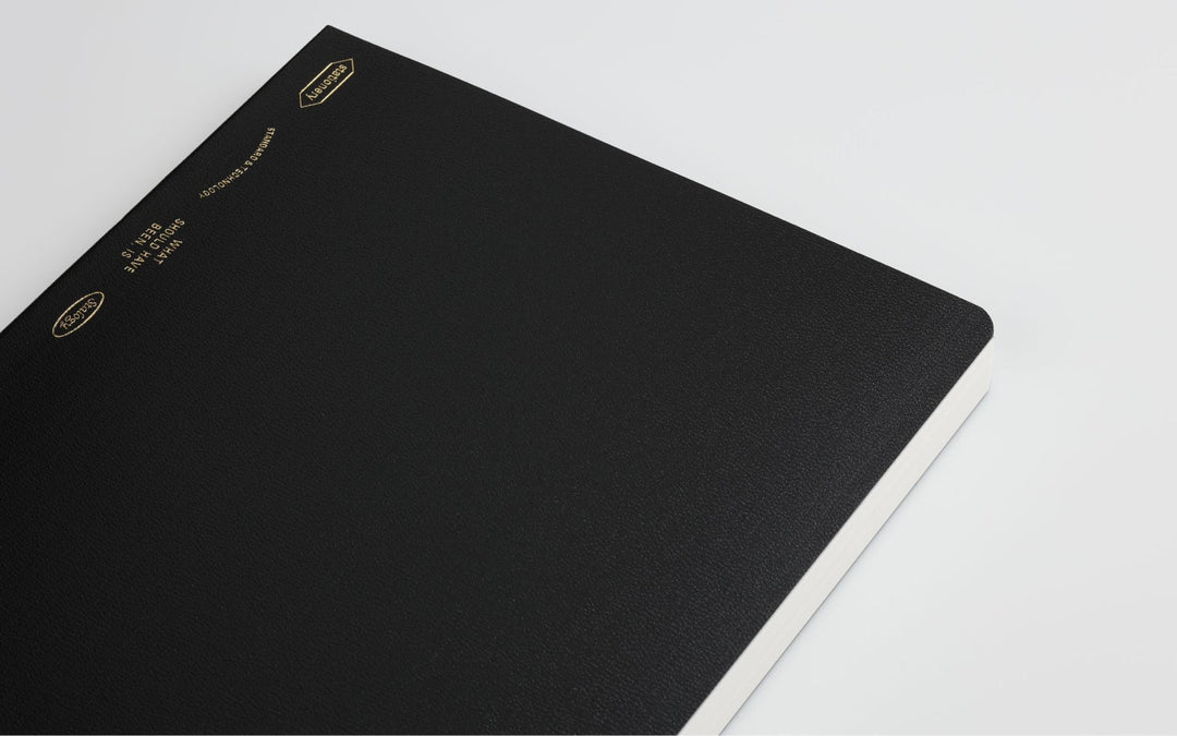 018 Editor’s Series 365 Days Dotgrid Notebook (A5, Black) with gold-foil text on a pebbled cover, ideal for fountain pen friendly daily planning.