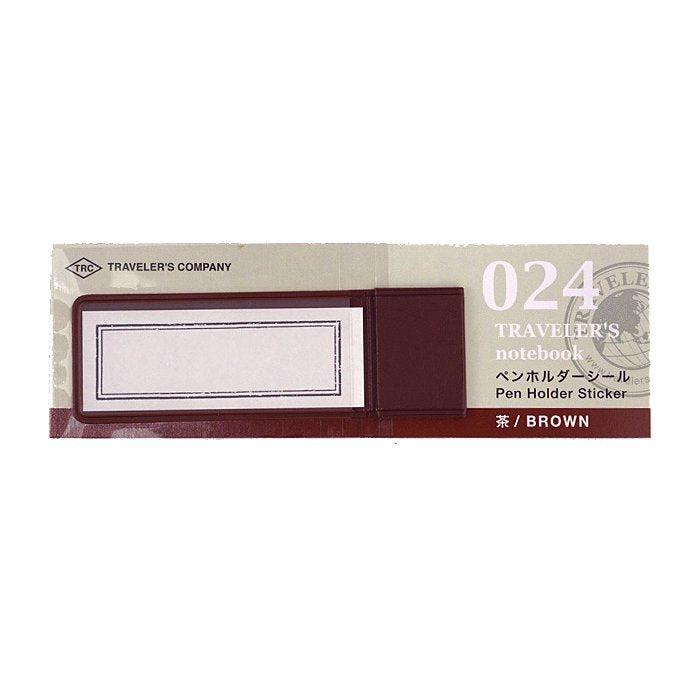 Pen Holder - Brown: A self-adhesive pen-holder sticker for Traveler’s Notebook, designed to securely hold a single pen or pencil inside the notebook cover.