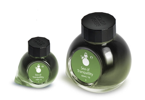 Sea of Tranquility - 65ml + 15ml Set: Two glass bottles of fountain-pen ink with octagonal black caps and green labels featuring an astronaut on a moon.