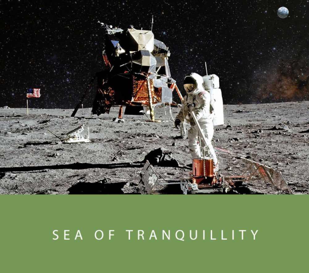 Sea of Tranquility - 65ml + 15ml Set. Astronaut on Moon's surface, U.S. flag, lunar module; olive-green base with title highlights ink’s celestial inspiration.