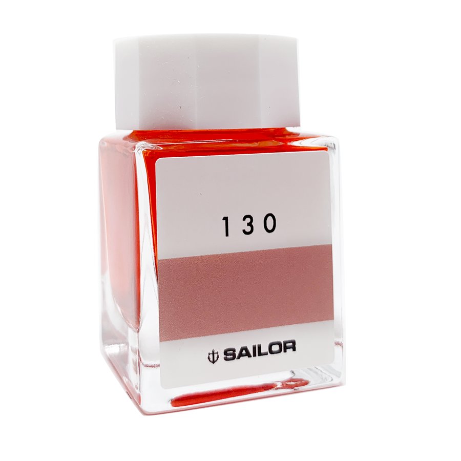 Square glass bottle of Sailor's Ink Studio #130 - 20ml with a white cap, showcasing visible reddish-pink ink inside, highlighting Sailor's curated collection.