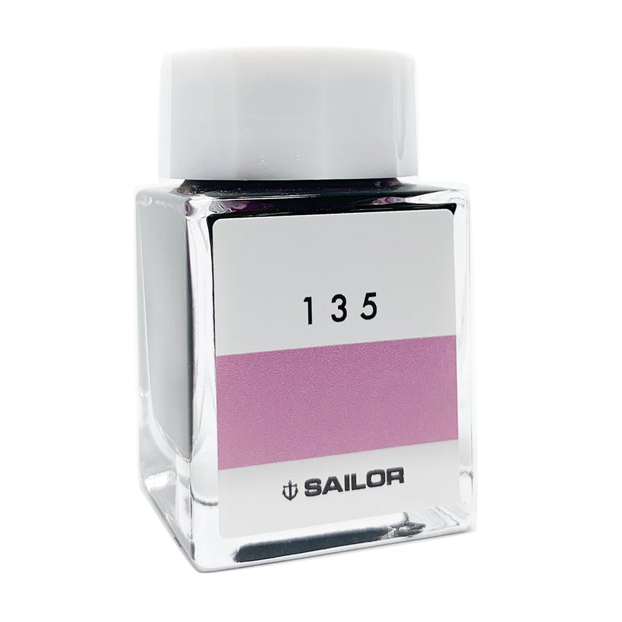 Square glass bottle of Sailor Ink Studio #135 - 20ml with a white cap, displaying a pinkish-purple label, showcasing Sailor's curated ink collection.