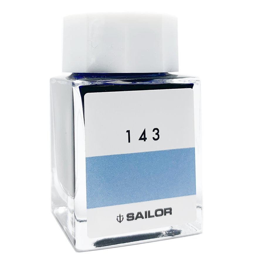 Sailor Ink Studio #143 in a small, square glass bottle with a light-blue swatch and label, holding 20ml of dye-based fountain-pen ink.