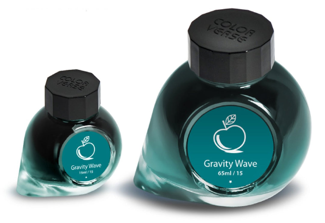 Two glass ink bottles from the Colorverse Gravity Wave 65ml + 15ml set, featuring black caps and teal labels with an apple-style icon.